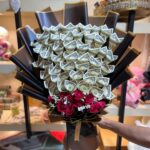 US dollar cash bouquet with forty $1 notes and red roses with baby's breath