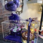 Luxury acrylic gift box with custom balloon, LED letter, cake, and flower chocolate bouquet for special occasions in Pakistan